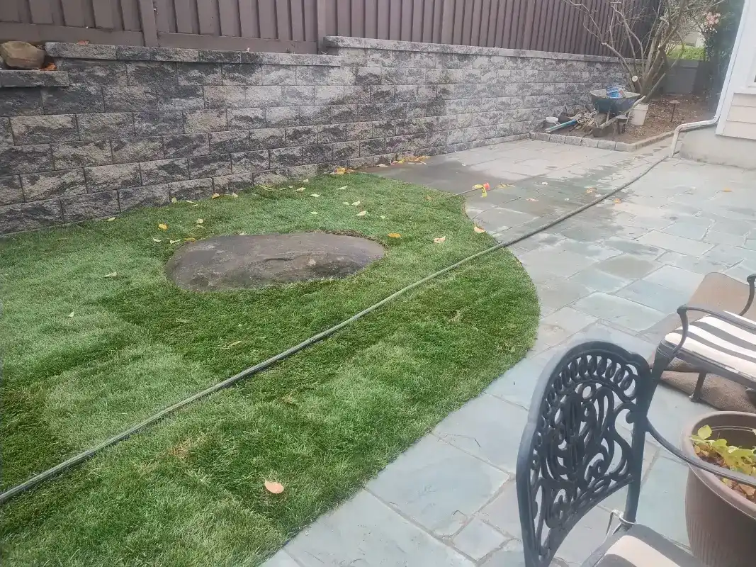 New lawn and patio with fire pit installation.
