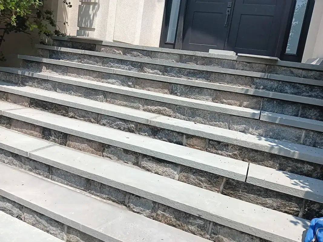 Stone steps leading to a home entrance.